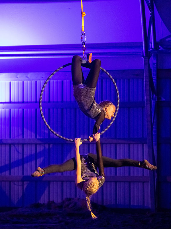 Two girls on an aerial hoop during a vaulting recital at Nation Valley Ranch in Chesterville, Ontario